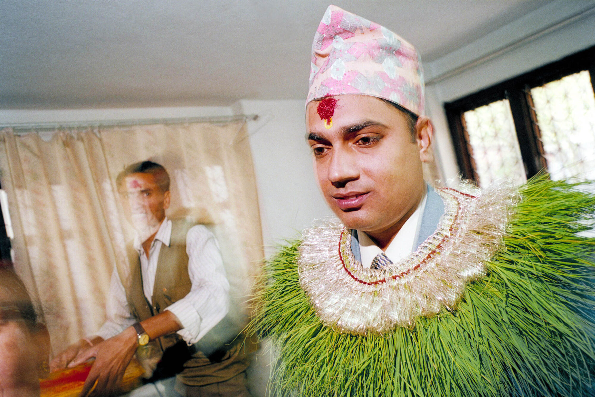 KATHMANDU 7. APRIL 2000 - Der Braeutigam wird in Nepals Hauptstadt Kathmandu von seinem Elternhaus reich beschmueckt verabschiedet.

Photo by Daniel Ammann