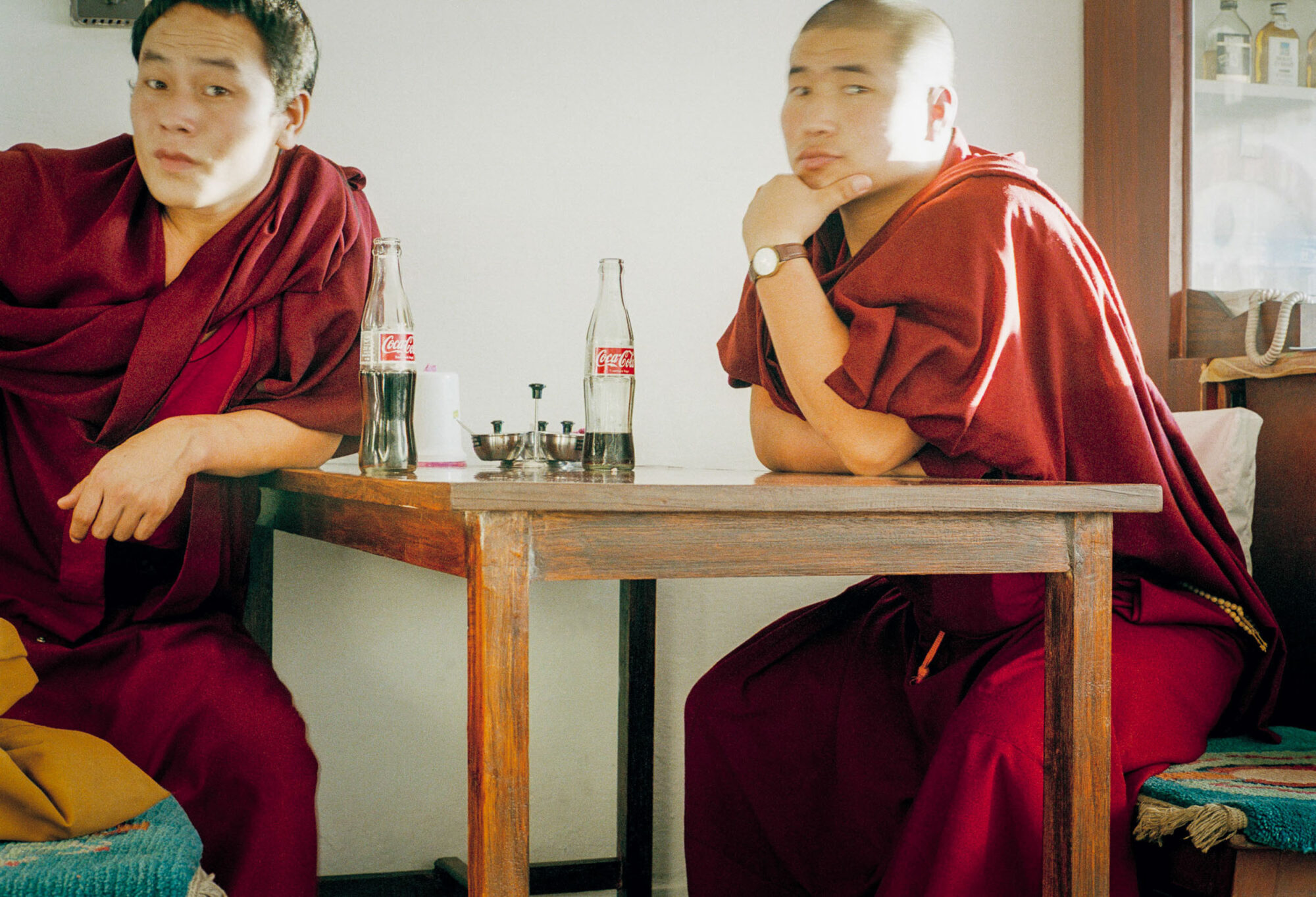 KATHMANDU 5. MAI 2000 - Zwei Buddhistische Moenche trinken in Nepals Hauptstadt Kathmandu in einem Laden ein Cola.

Photo by Daniel Ammann